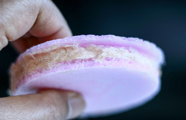 Rambut Nenek or Arumanis (Cotton Candy with Crackers) on black background. Indonesian Traditional Food.