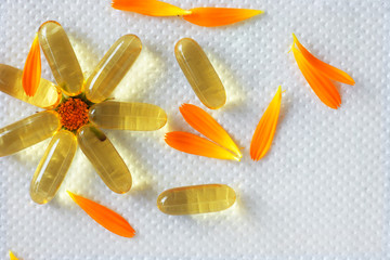 Fish oil capsule, flower, white background 1