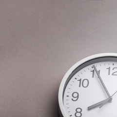 Close-up of alarm clock against gray background