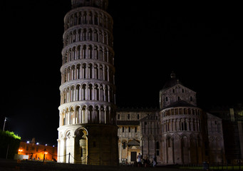 Tower and church of Pisa by night in Tuscany Italy