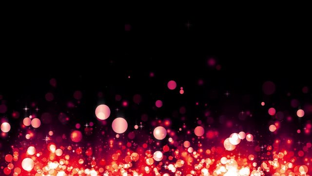 Glittering rising red particles. Background with shiny particles. Beautiful bokeh light background. Red confetti shimmering with magical sparkling light. Seamless loop