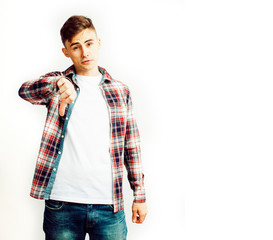 young handsome teenage hipster guy posing emotional, happy smiling against white background isolated, lifestyle people concept close up
