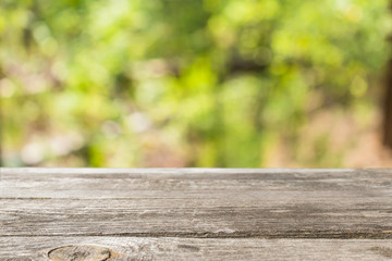 Wood hunter table with forest blur background