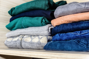 In the closet are new sweaters and jeans, bought by autumn.