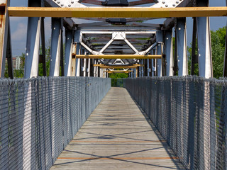 wooden bike trail bridge across the river in Quebec