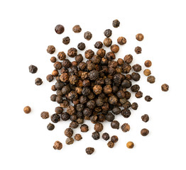 Pile of black pepper peas on a white background. The view of the top.