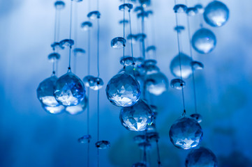 Obraz na płótnie Canvas Defocus blue crystal balls hanging