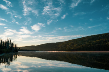 Sweeping wide angle view of Stanley Lake Idaho, during sunrise in the Sawtooth Mountains