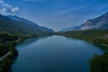 Fototapeta na wymiar Aerial photography. Panoramic view of a small lake north of Italy. Trento region. Great trip to the lake in the Alps.