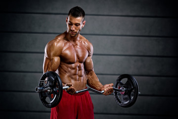 Fototapeta na wymiar Handsome Muscular Men Lifting Weights