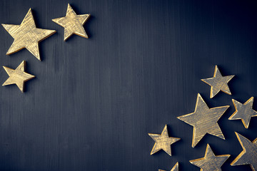 Golden Christmas Stars  Rustic on a dark background, Copyspace, handmade