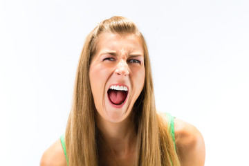 Close-up of young woman shouting