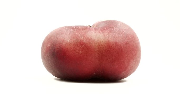 Donut peach isolated rotates on itself on white background. Snuffbox, Saturn, Tabacchiera rotation. Organic fruit.