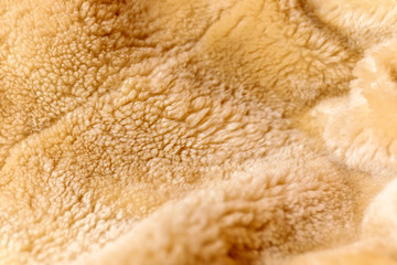 Close up fragment of a brown colored artificial fur texture