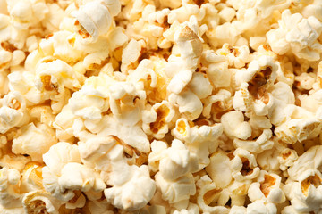 Delicious popcorn on whole background, close up