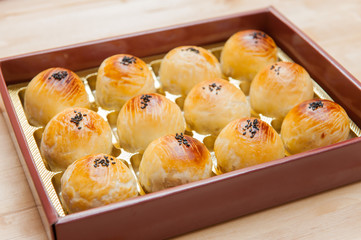 Chinese pastry or Moon cake, top view, Mooncake is a Chinese bakery product traditionally eaten during the Mid-Autumn Festival.