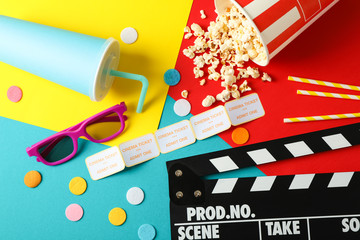 Composition with movie watching accessories on multicolor background, top view