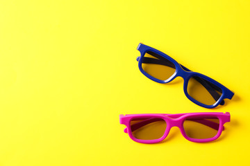 Flat lay composition with 3d glasses on yellow background