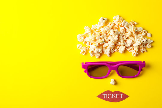 Flat lay composition with movie watching accessories on yellow background, top view