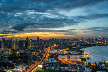 Fototapeta na wymiar Sky view of Bangkok with skyscrapers in the business district in Bangkok along the Chao Phraya Rive in the during beautiful twilight give the city a modern style.