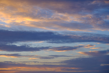 Naklejka na ściany i meble Twilight sky during sunset with golden and blue