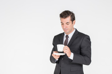 Successful Businessman handsome wearing a suit Tie executive holding  coffee in morningcup 