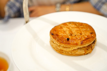 Tasty baked chicken pot pie on white plate