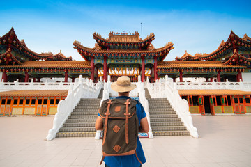 Man backpacker tourist is visiting Thean Hou Temple in Kuala Lumpur, Malaysia.