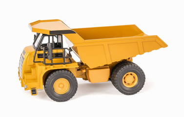Toy dump truck with open-box bed. Children's toy plastic haul truck car with isolated on white background