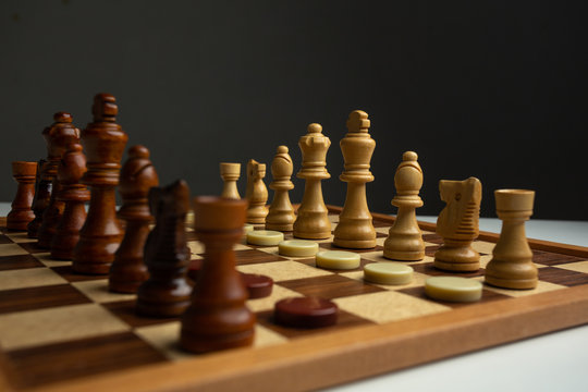 Chess placed on a wooden table,concept : of business strategy and tactic battle,symbol competition game success play victory war 