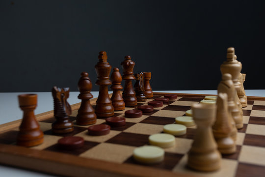 Chess placed on a wooden table,concept : of business strategy and tactic battle,symbol competition game success play victory war 