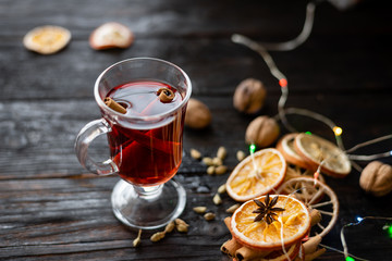 a glass of aromatic mulled wine on the table, a delicious wine with spices