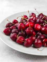 Cherry on a white plate