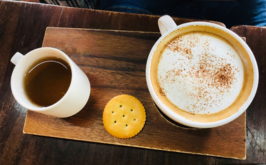 Close-up of coffee cup and tea cup on a table in cafe