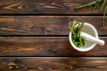 Healing herbs for medicine on wooden background top view mockup