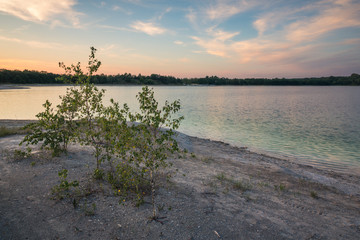 Azure lake called Osadnik Gajowka near Psary village, Poland