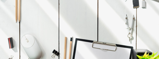 Architectural plans, pencil and ruler on the table. Laptop and accessories. Place for your text.