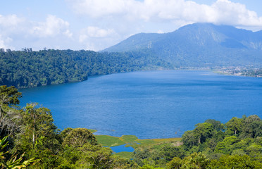 Fototapeta premium View of lake Buyan (Danau Buyan) from the top. Landscape with lake and mountain views. Bedugul, Buleleng, Bali, Indonesia.