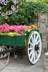 Fototapeta na wymiar Old cart with flowers