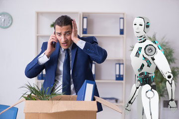 Concept of robots replacing humans in offices