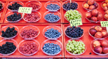 Raspberries, blueberries, grapes  is for sale in Hötorget's square store