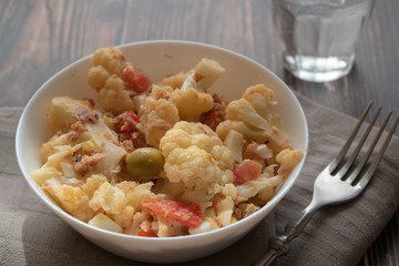 Healthy mediterranean cauliflower salad with tomato
