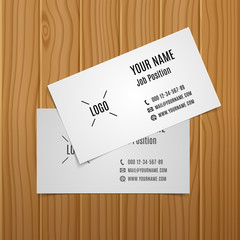 Template business cards on wooden surface