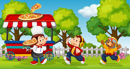 Obraz na płótnie Canvas Animals serving pizza in the park