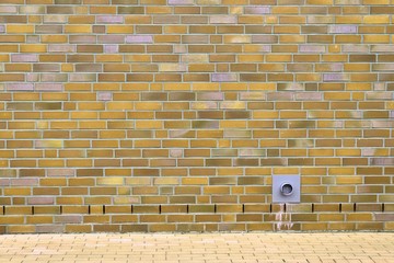 Yellow brick walls with old and weathered stones and cracks im high resolution