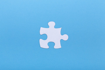 Closeup of jigsaw puzzle on blue background Missing jigsaw puzzle piece, business concept for...