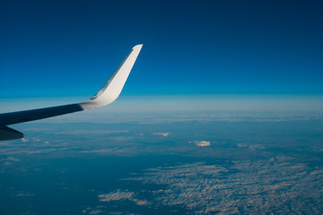 Aerial view from plane on blue sky
