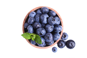 blueberries with mint in wooden bowl