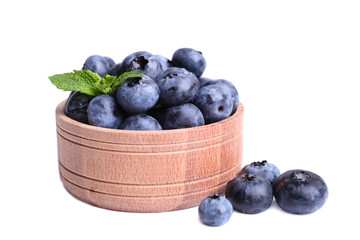 blueberries with mint in wooden bowl