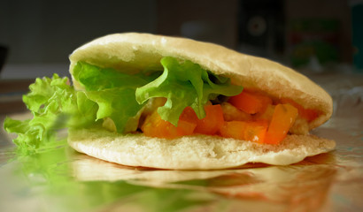 Sandwich with green salad and tomatoes